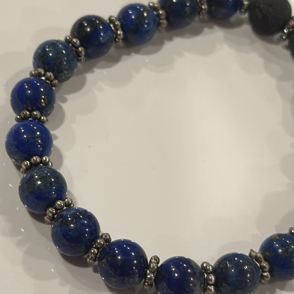 Blue azule gemstone stretchy artisan homemade bracelet with gold Buddha bead.